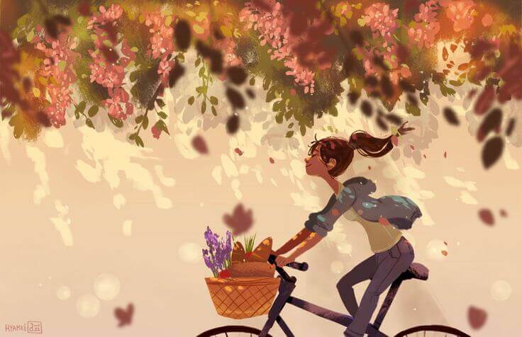 Iloinen tyttö pyöräilee