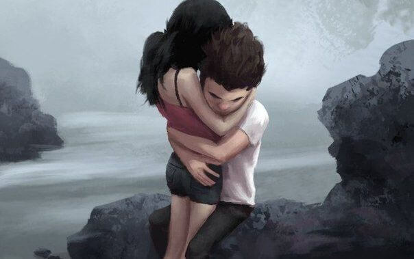 pariskunta halaa rannalla