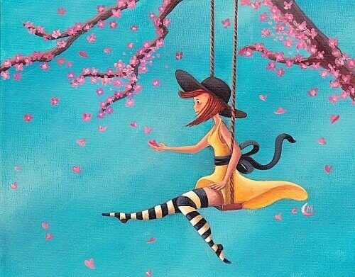 Nainen keinuu puussa