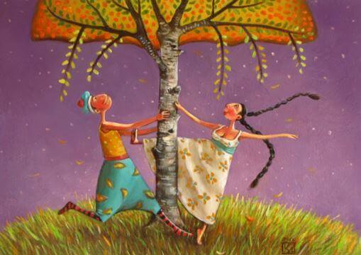 Pariskunta tanssii puun alla