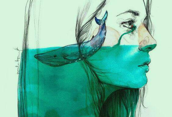 naisen päässä on vettä ja valas