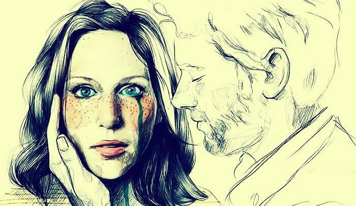 nainen itkee ja mies lohduttaa