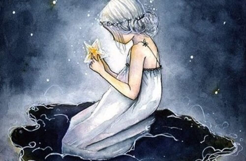 tyttö pitelee tähteä käsissään