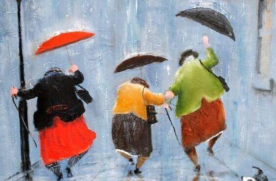 mummot tanssivat sateessa sateenvarjojen kanssa