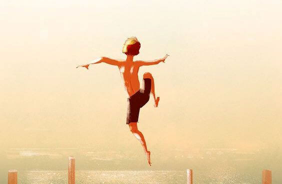 poika hyppää laiturilta veteen