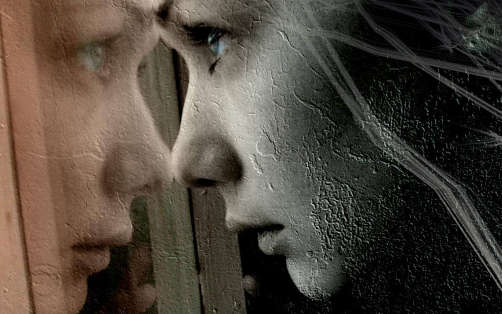 tyttö katsoo ikkunan läpi