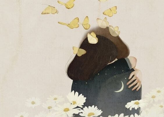 kaksi ihmistä halaa perhosten ja kukkien keskellä