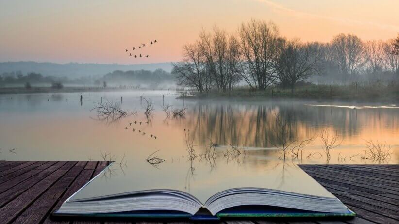 avoin kirja johon järvi heijastuu
